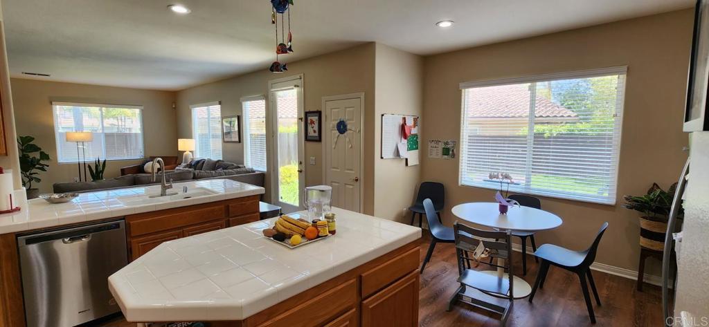 6848 Moorhen Place Carlsbad, CA 92009 - Photo 16 of 53 a dining room with furniture and window