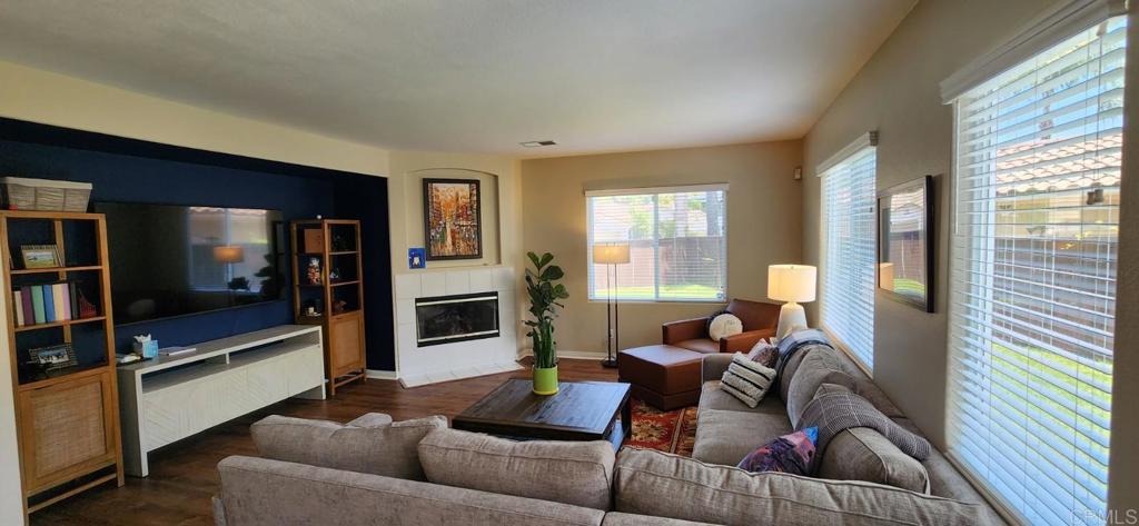 6848 Moorhen Place Carlsbad, CA 92009 - Photo 17 of 53 a living room with furniture and a flat screen tv