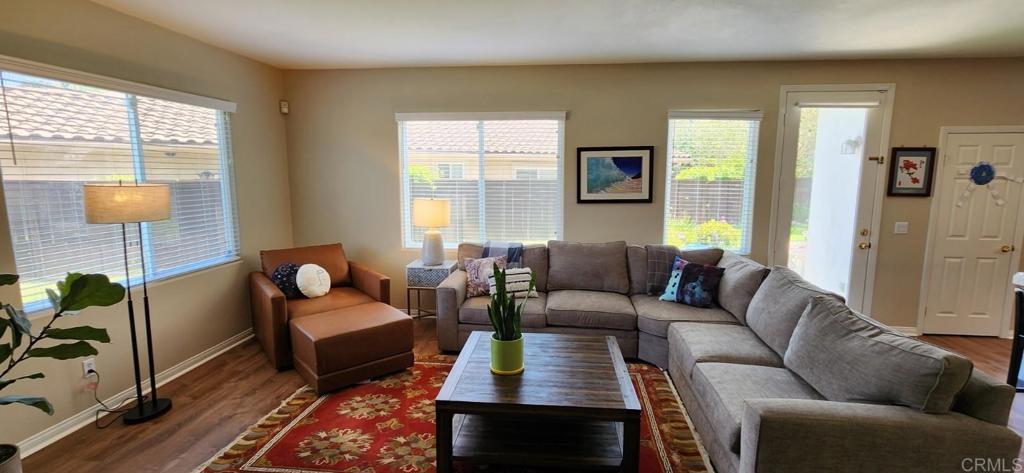 6848 Moorhen Place Carlsbad, CA 92009 - Photo 18 of 53 a living room with furniture rug and window