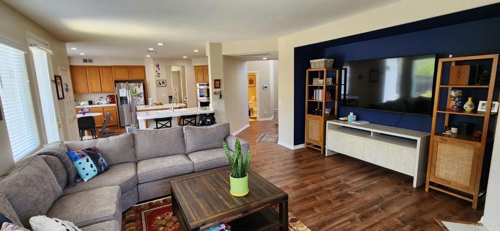 6848 Moorhen Place Carlsbad, CA 92009 - Photo 19 of 53 a living room with furniture and a flat screen tv
