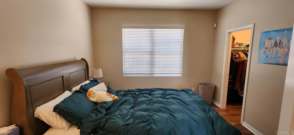 6848 Moorhen Place Carlsbad, CA 92009 - Photo 29 of 53 a bed sitting in a bedroom next to a window