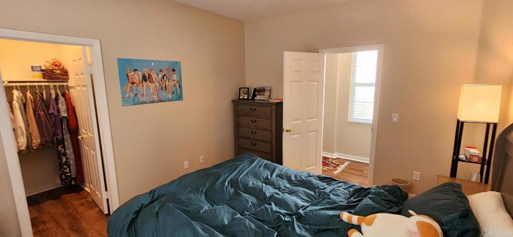 6848 Moorhen Place Carlsbad, CA 92009 - Photo 30 of 53 a bedroom with a bed and a window