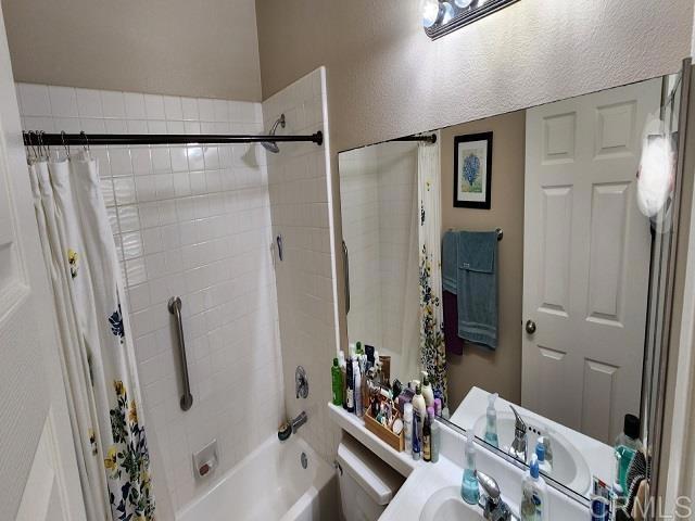 6848 Moorhen Place Carlsbad, CA 92009 - Photo 32 of 53 a bathroom with a bathtub shower sink and toilet