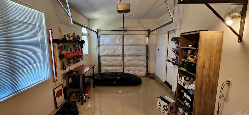 6848 Moorhen Place Carlsbad, CA 92009 - Photo 36 of 53 a view of walk in closet with clothes and shoes