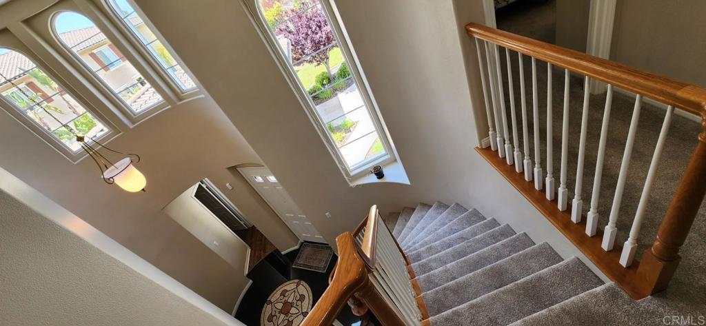 6848 Moorhen Place Carlsbad, CA 92009 - Photo 37 of 53 a view of entryway and hall with wooden floor
