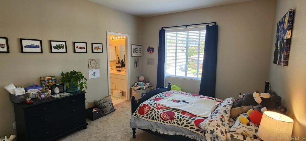 6848 Moorhen Place Carlsbad, CA 92009 - Photo 48 of 53 a bedroom that has a bed and a window