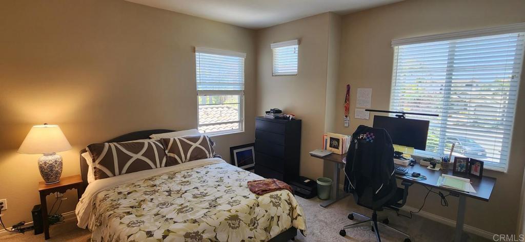 6848 Moorhen Place Carlsbad, CA 92009 - Photo 49 of 53 a bedroom with a bed and a desk