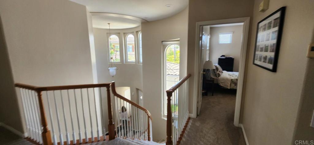6848 Moorhen Place Carlsbad, CA 92009 - Photo 52 of 53 a view of a hallway and a livingroom with furniture