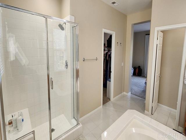 6848 Moorhen Place Carlsbad, CA 92009 - Photo 53 of 53 a bathroom with a shower and a glass door