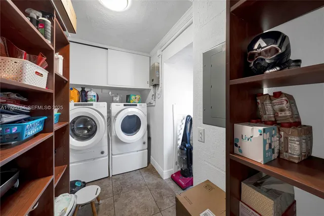 a kitchen with stainless steel appliances granite countertop a refrigerator a stove a sink a oven and a refrigerator