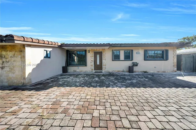 a backyard of a house with a yard