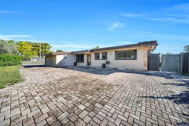 a living room with furniture and flowers