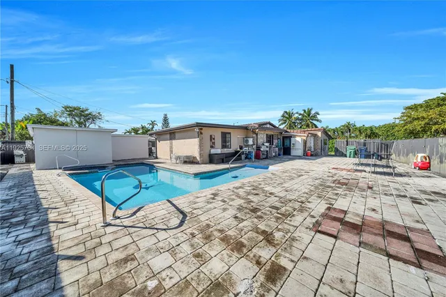 a view of a house with swimming pool