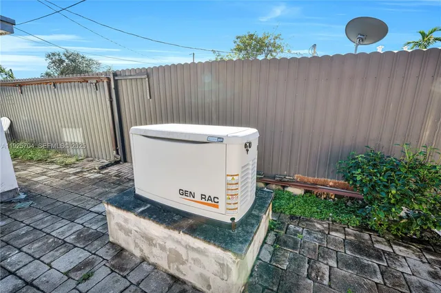 a view of a backyard with sitting area