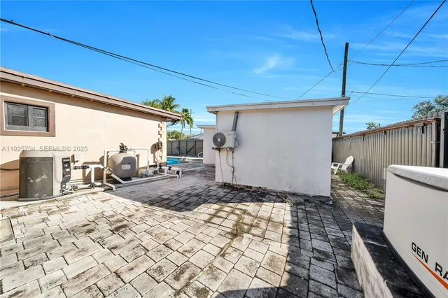 a kitchen with stainless steel appliances granite countertop a stove refrigerator and microwave