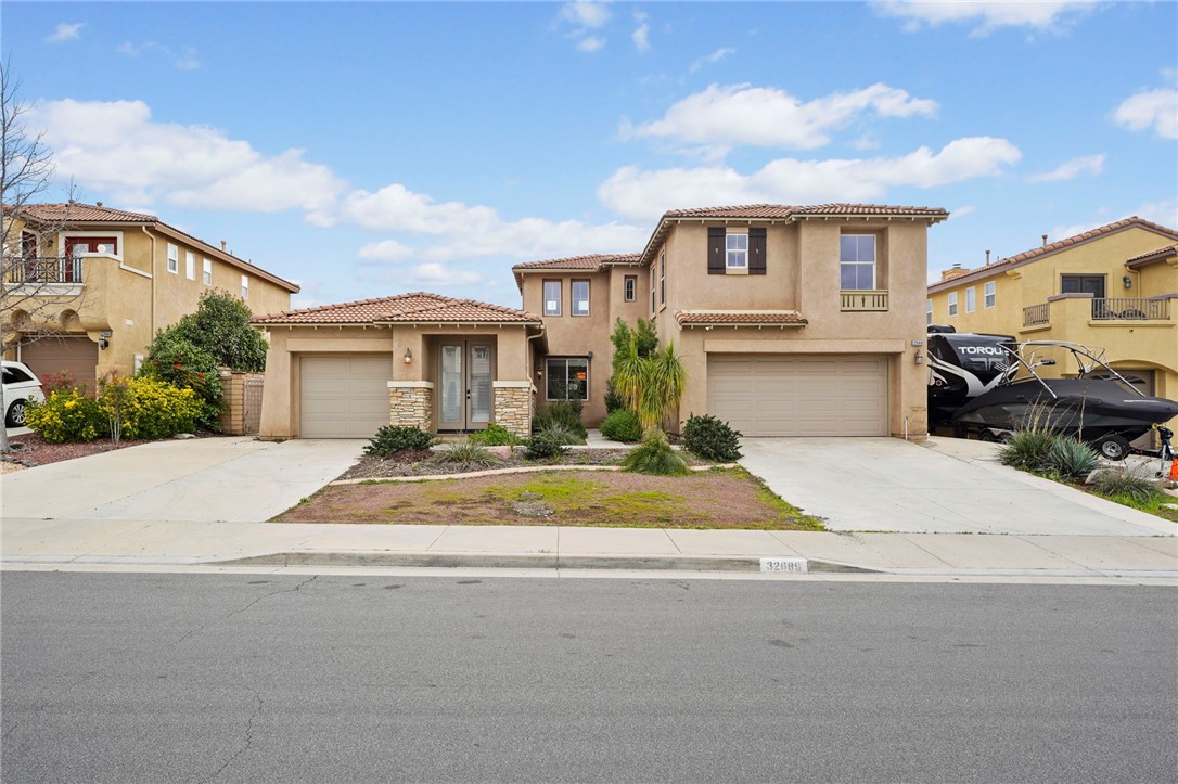 32689 Cottonwood Road Winchester, CA 92596 - Photo 1 of 1 a front view of a house with a yard and garage