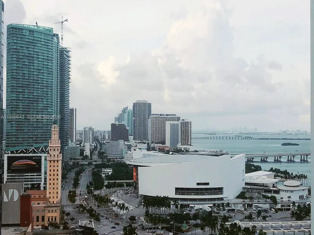 a view of a patio with couches and potted plants