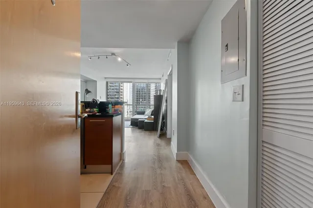 a view of living room with furniture and wooden floor