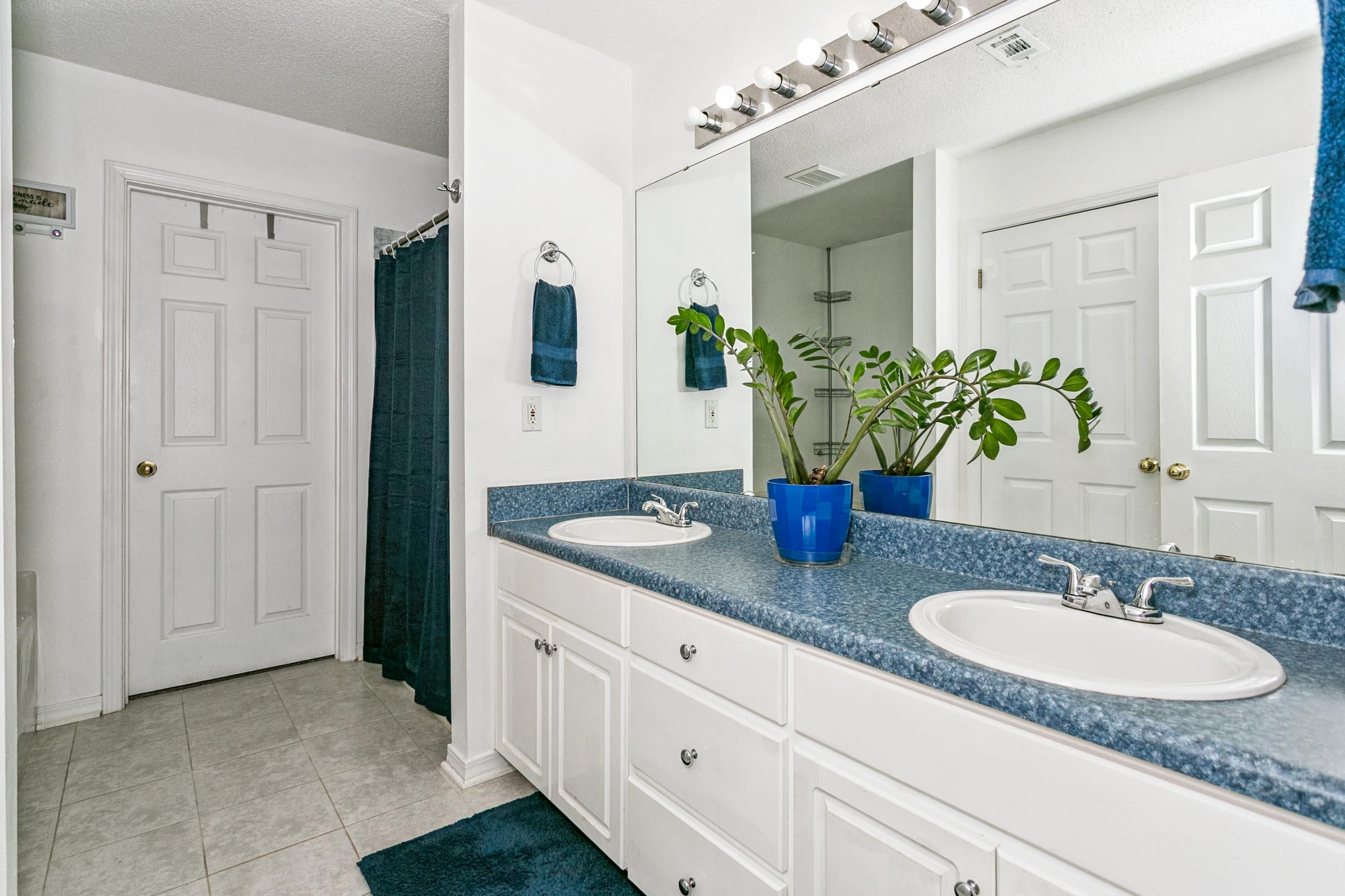 2246 Titanium Drive Crestview, FL 32536 - Photo 14 of 38 a bathroom with a sink and a mirror