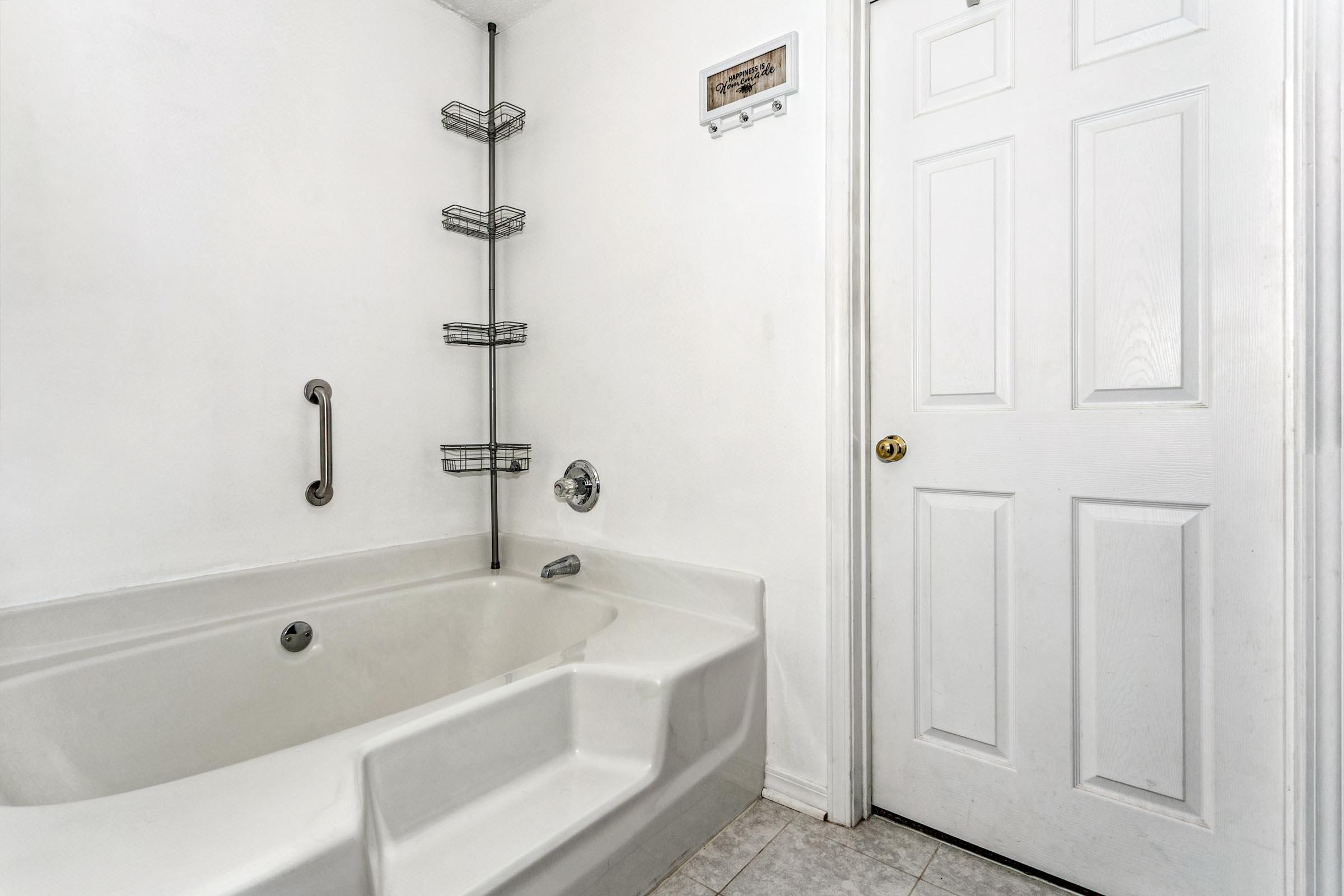 2246 Titanium Drive Crestview, FL 32536 - Photo 15 of 38 a white bath tub sitting next to a shower