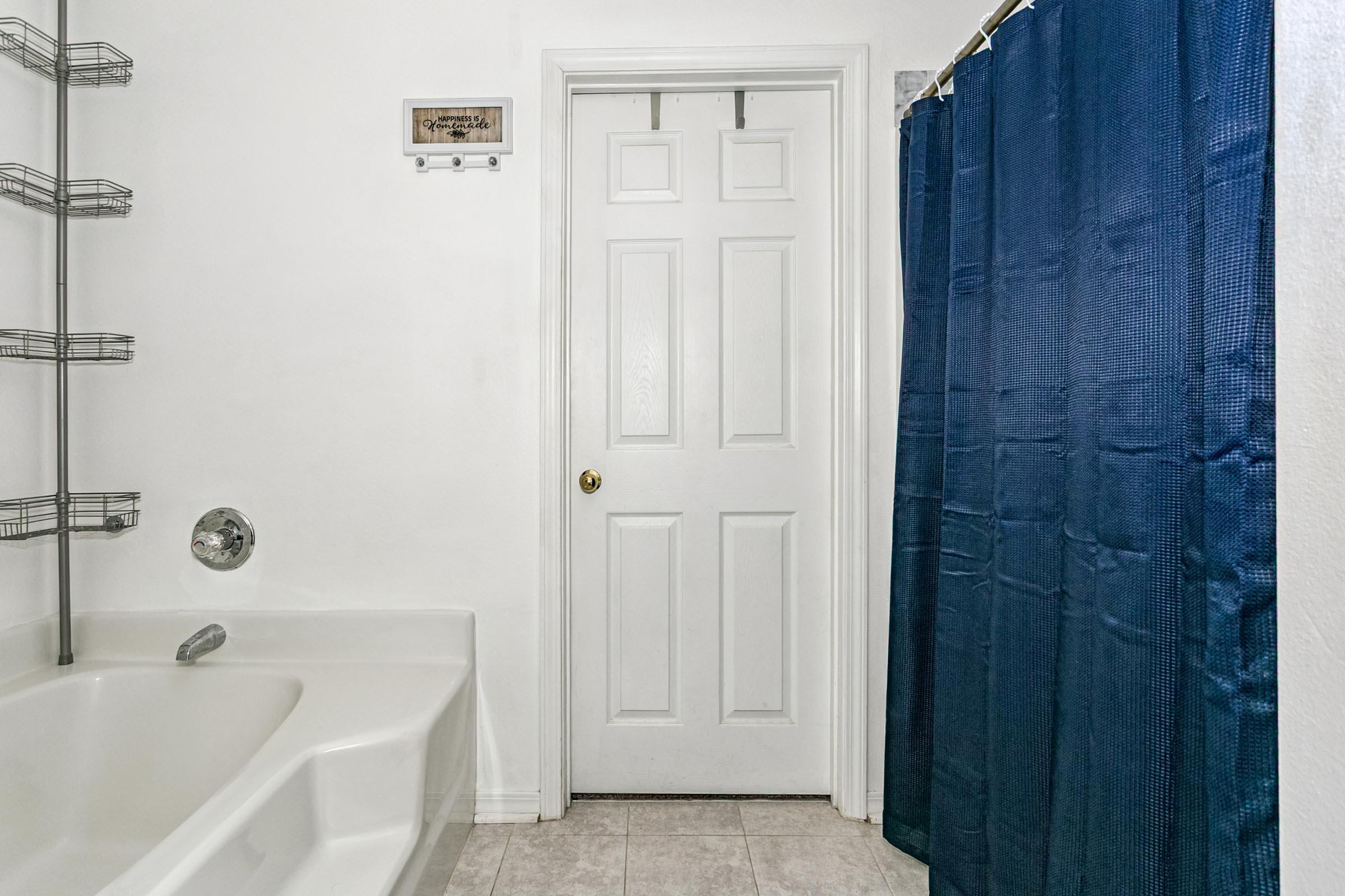 2246 Titanium Drive Crestview, FL 32536 - Photo 16 of 38 a bathroom with a bathtub