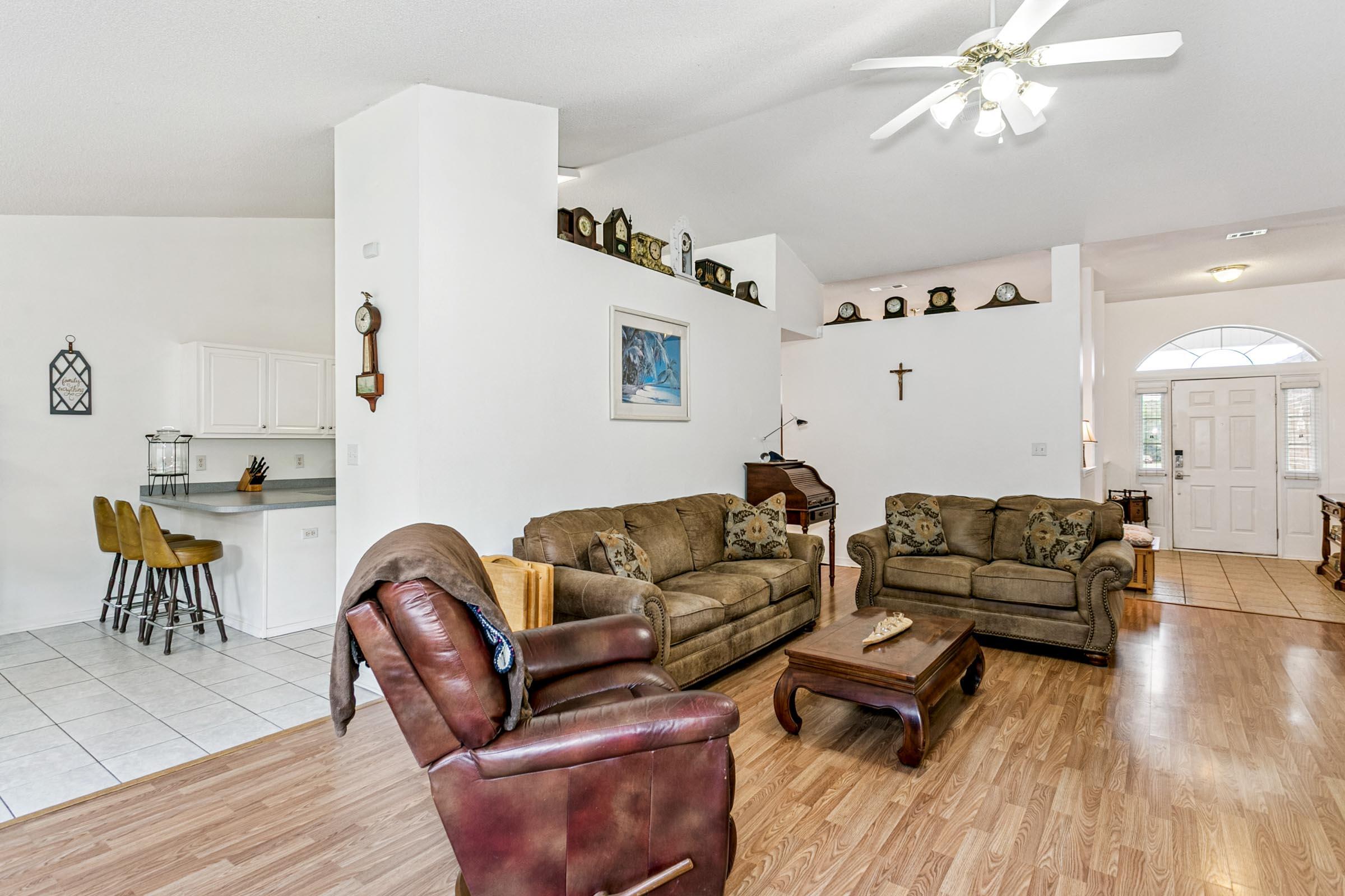 2246 Titanium Drive Crestview, FL 32536 - Photo 2 of 38 a living room with furniture and a wooden floor
