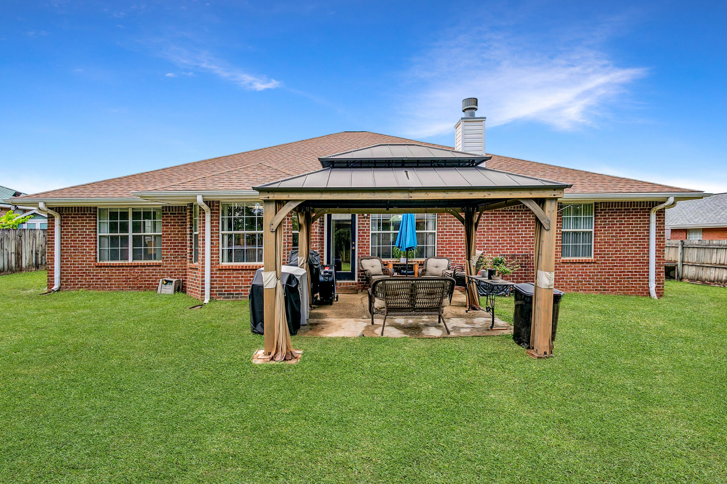 2246 Titanium Drive Crestview, FL 32536 - Photo 26 of 38 a front view of a house with garden