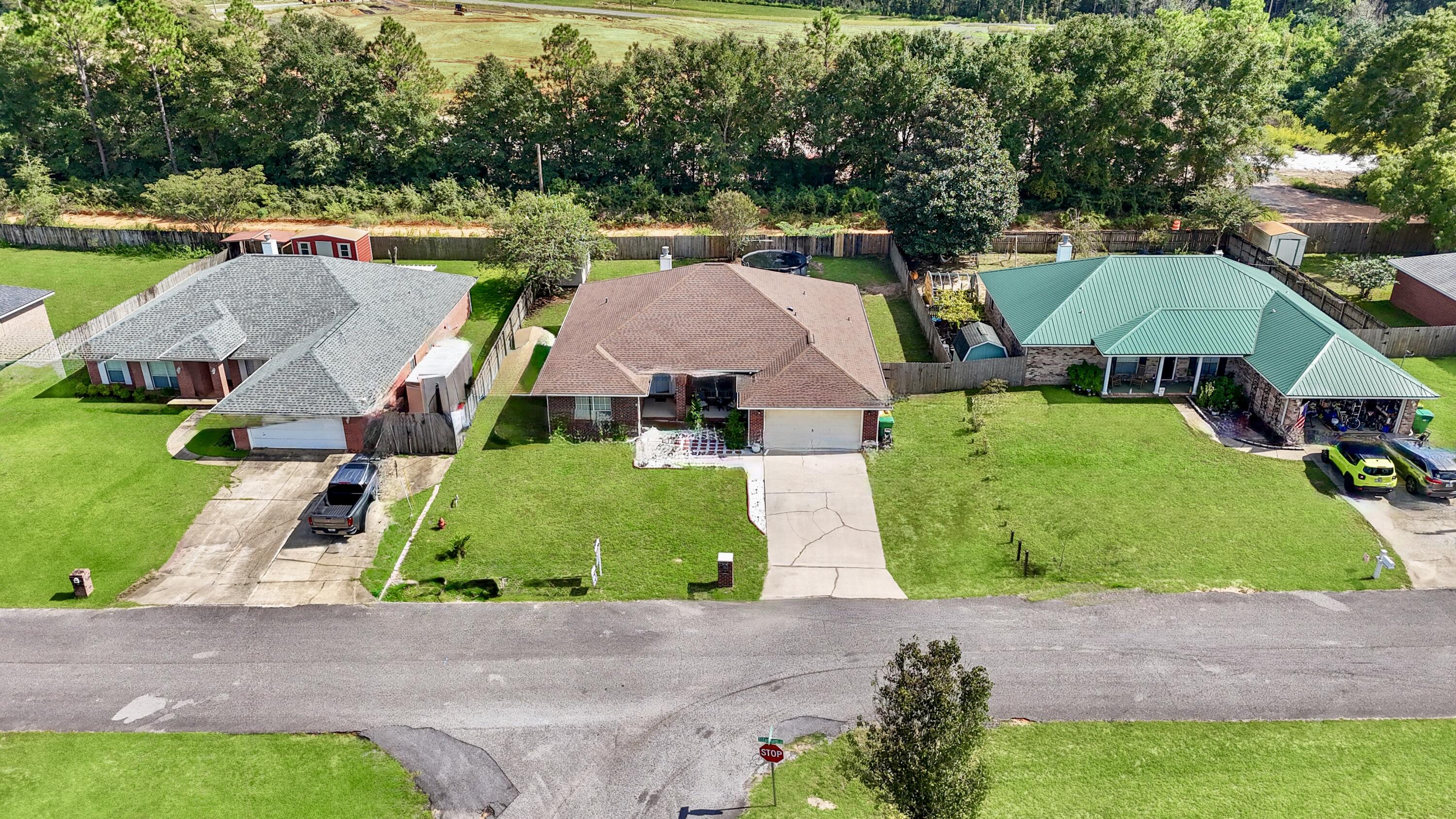 2246 Titanium Drive Crestview, FL 32536 - Photo 35 of 38 a aerial view of a house with garden space and street view