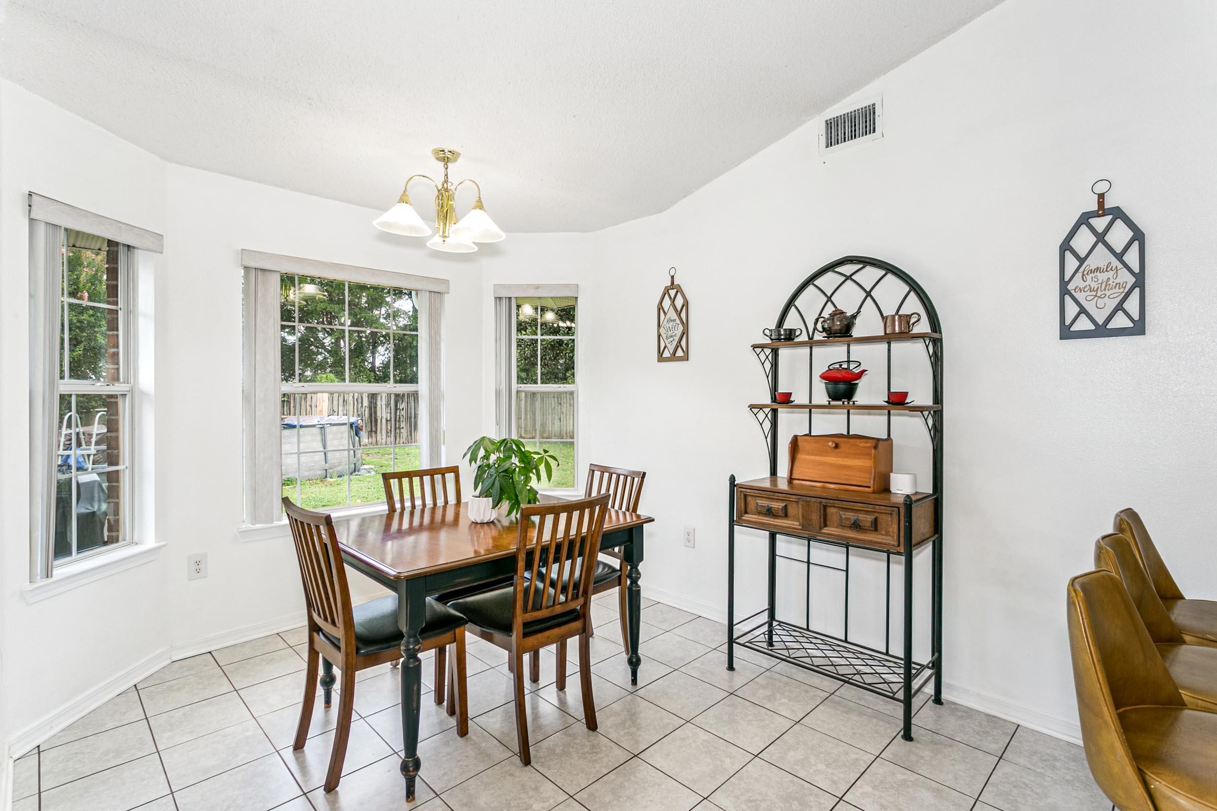 2246 Titanium Drive Crestview, FL 32536 - Photo 4 of 38 a view of a dining room with furniture window and outside view