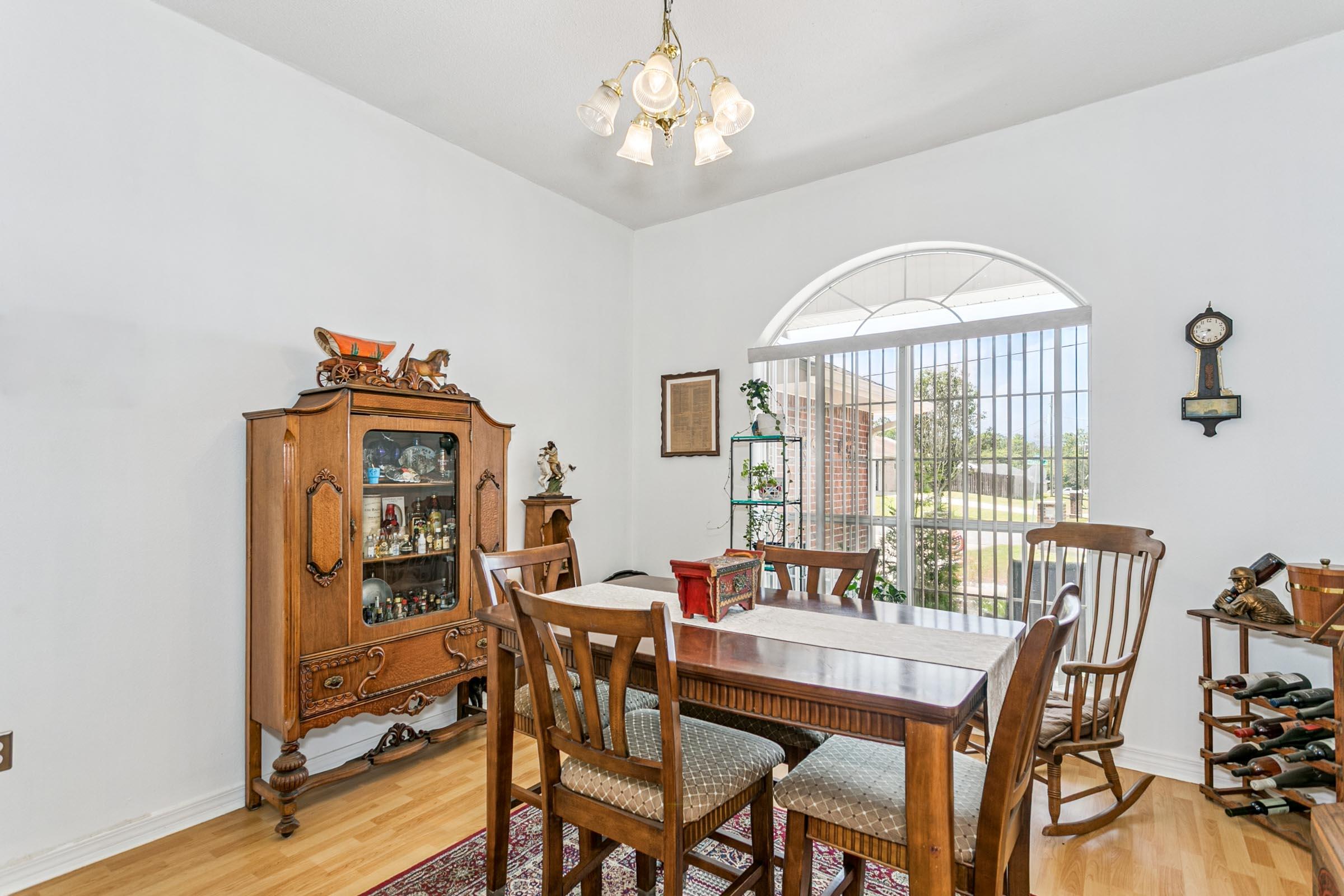 2246 Titanium Drive Crestview, FL 32536 - Photo 10 of 38 a view of a dining room with furniture window and wooden floor