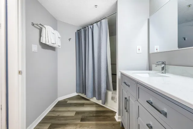 a view of a kitchen from the hallway