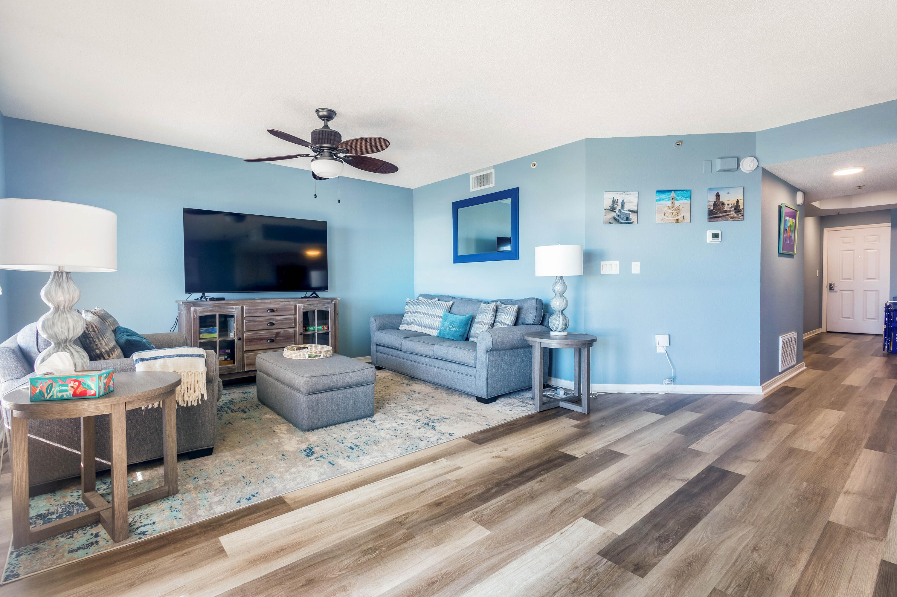 790 Santa Rosa Boulevard, Unit 2008 Fort Walton Beach, FL 32548 - Photo 30 of 33 a living room with furniture and a flat screen tv