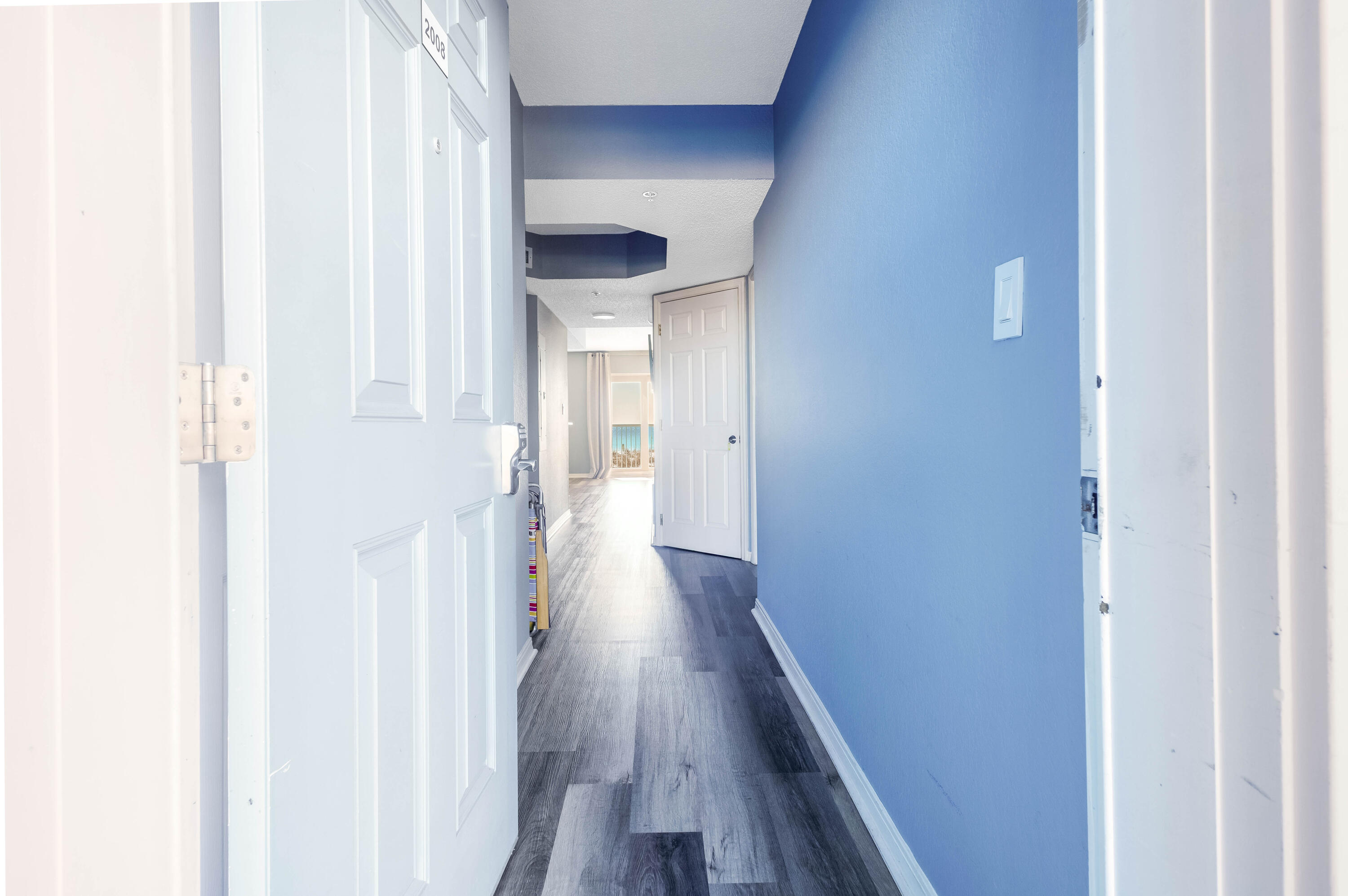 790 Santa Rosa Boulevard, Unit 2008 Fort Walton Beach, FL 32548 - Photo 9 of 33 a view of a hallway with wooden floor