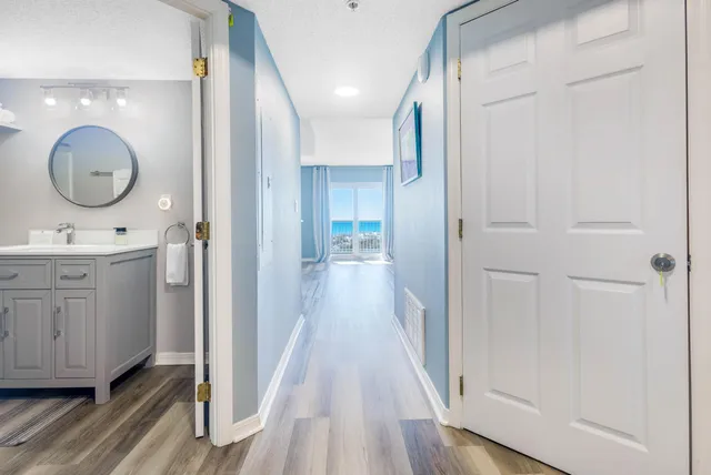a view of a bathroom from a hallway