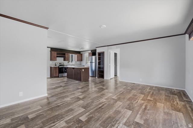 433 North 750 West Logan, UT 84321 - Photo 4 of 40 Spacious living area featuring wood-finish flooring and a neutral color palette