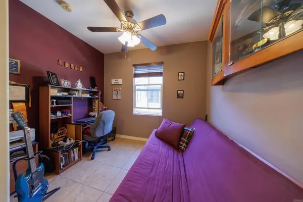 a bed room with a bed and a chair