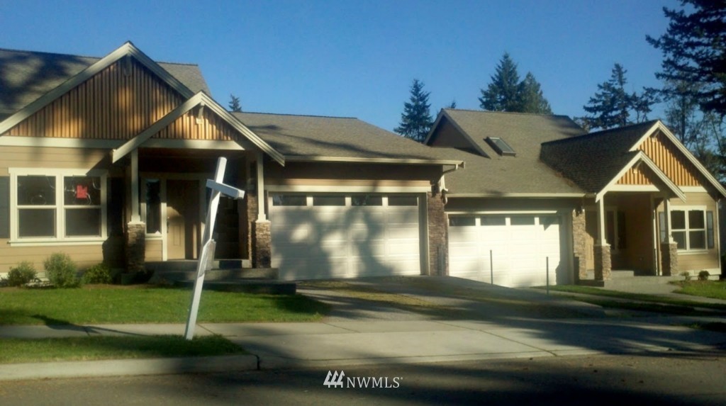 9 213th Street Southwest Bothell, WA 98021 - Photo 1 of 1 a front view of a house with a yard