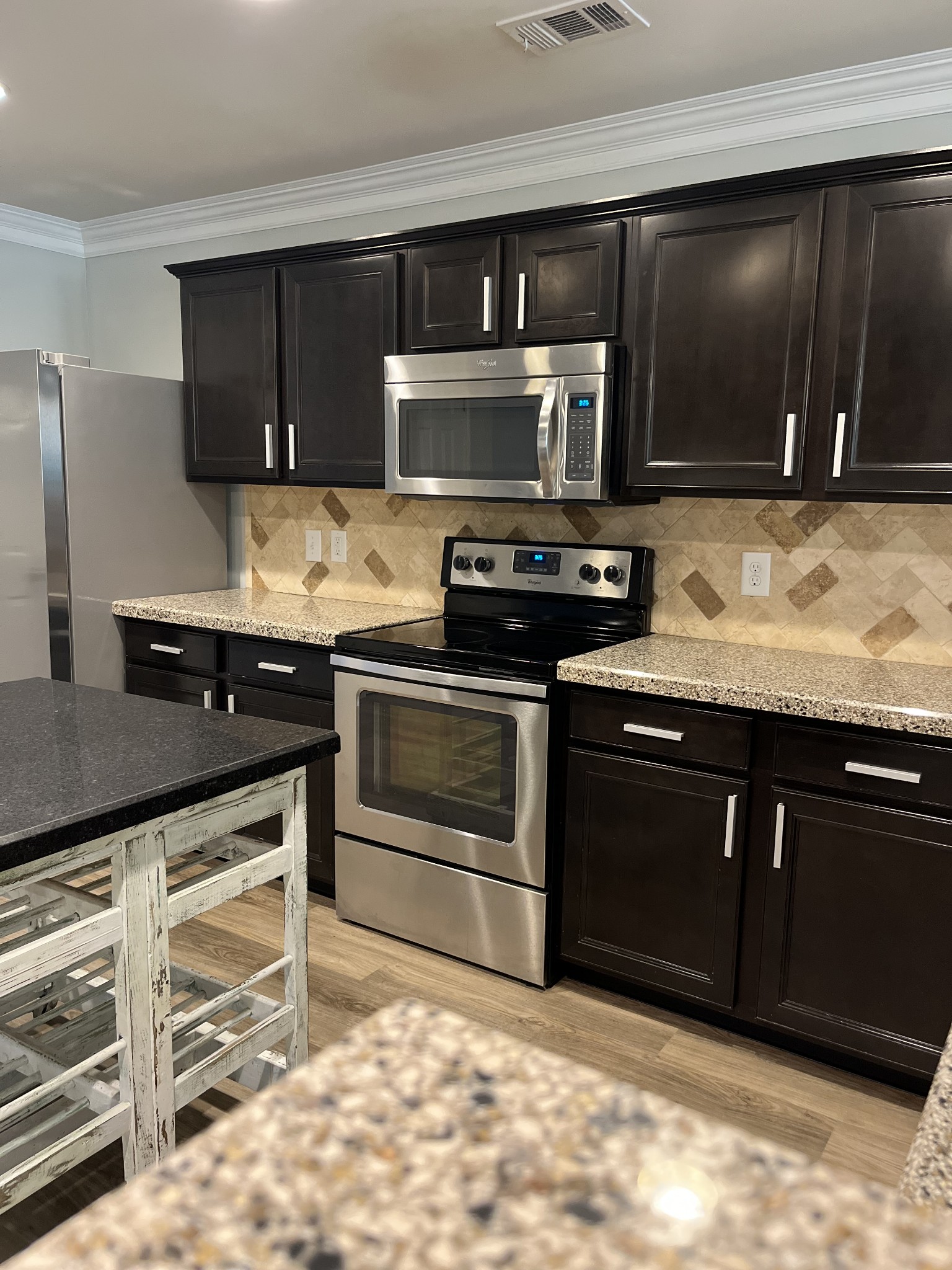1005 Benwick Road Hendersonville, TN 37075 - Photo 12 of 12 a kitchen with stainless steel appliances granite countertop a stove and a microwave