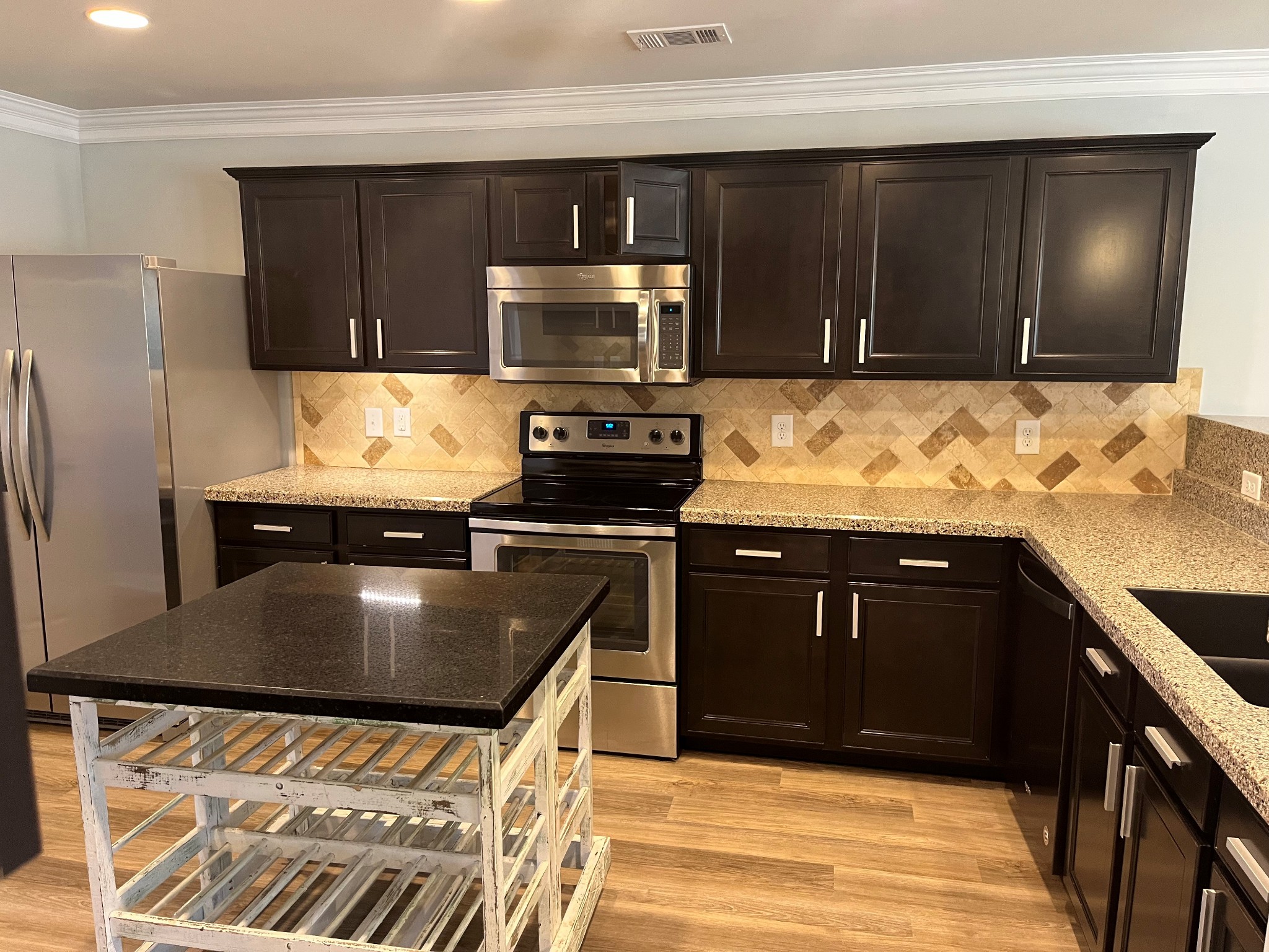 1005 Benwick Road Hendersonville, TN 37075 - Photo 2 of 12 a kitchen with stainless steel appliances granite countertop a stove and a refrigerator