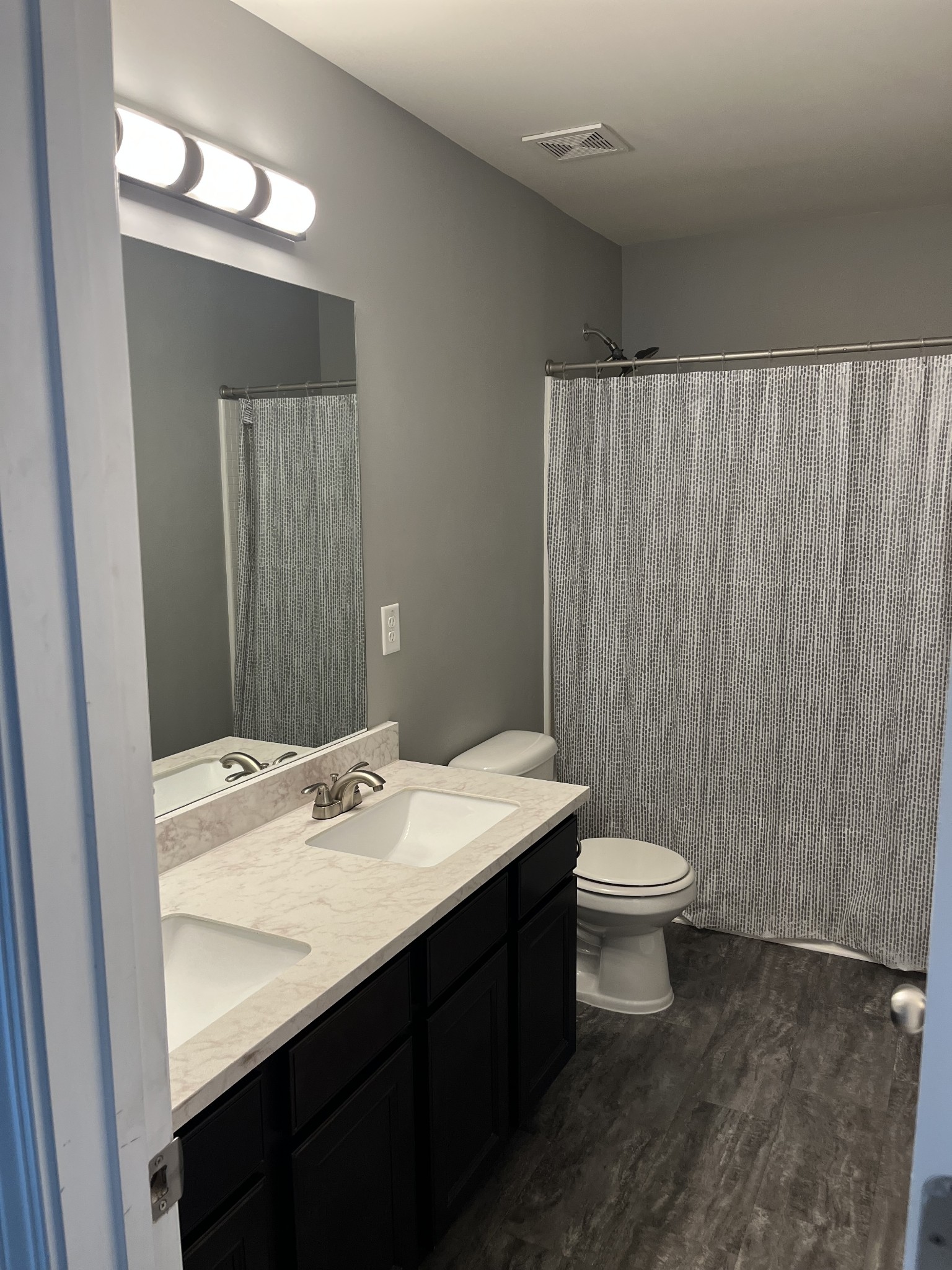 1005 Benwick Road Hendersonville, TN 37075 - Photo 5 of 12 a bathroom with a sink a toilet and mirror