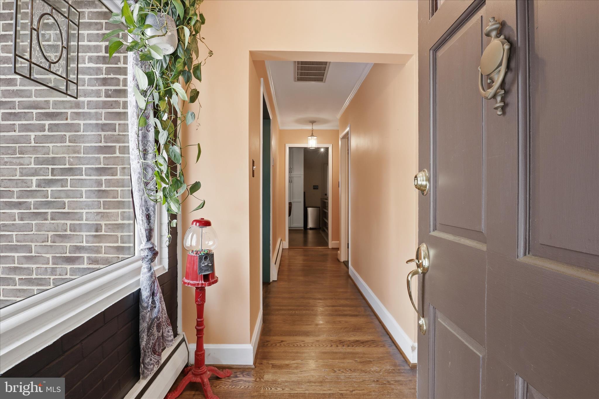6415 South Clifton Road Frederick, MD 21703 - Photo 12 of 53 a view of a hallway with wooden floor and staircase
