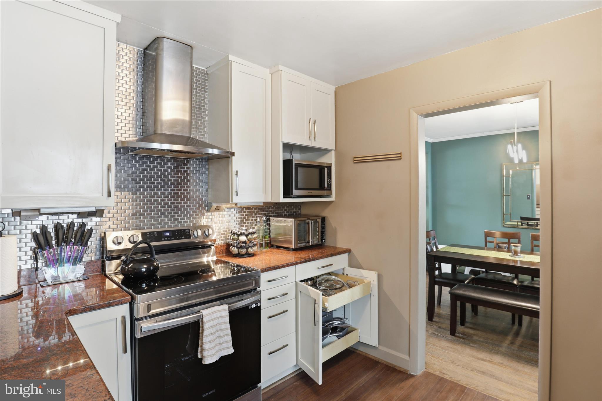 6415 South Clifton Road Frederick, MD 21703 - Photo 19 of 53 a kitchen with stainless steel appliances a stove a sink and a microwave