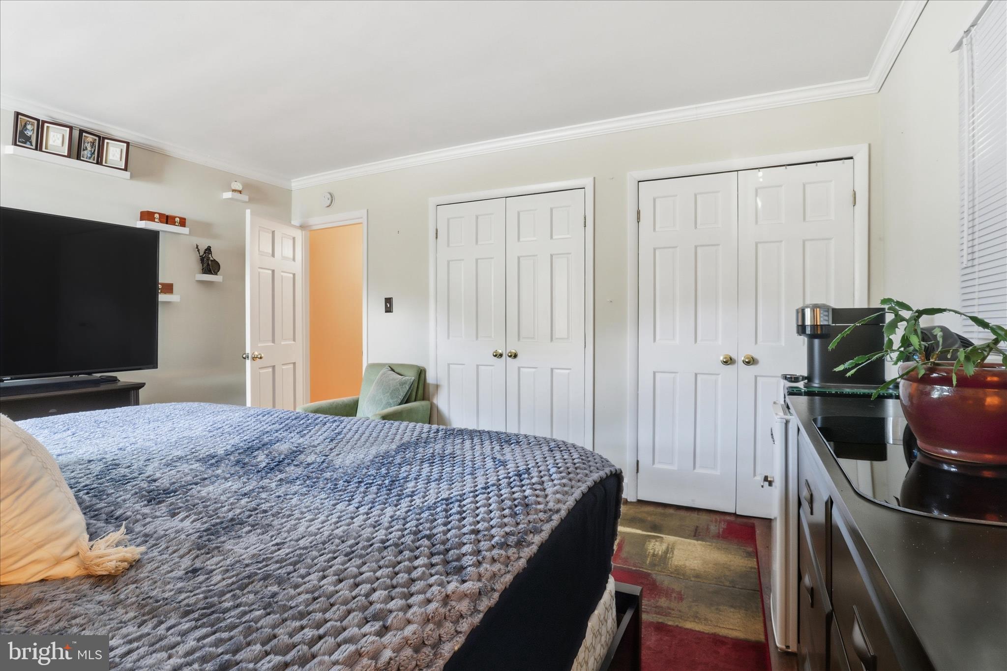 6415 South Clifton Road Frederick, MD 21703 - Photo 22 of 53 a bedroom with a bed and a flat screen tv