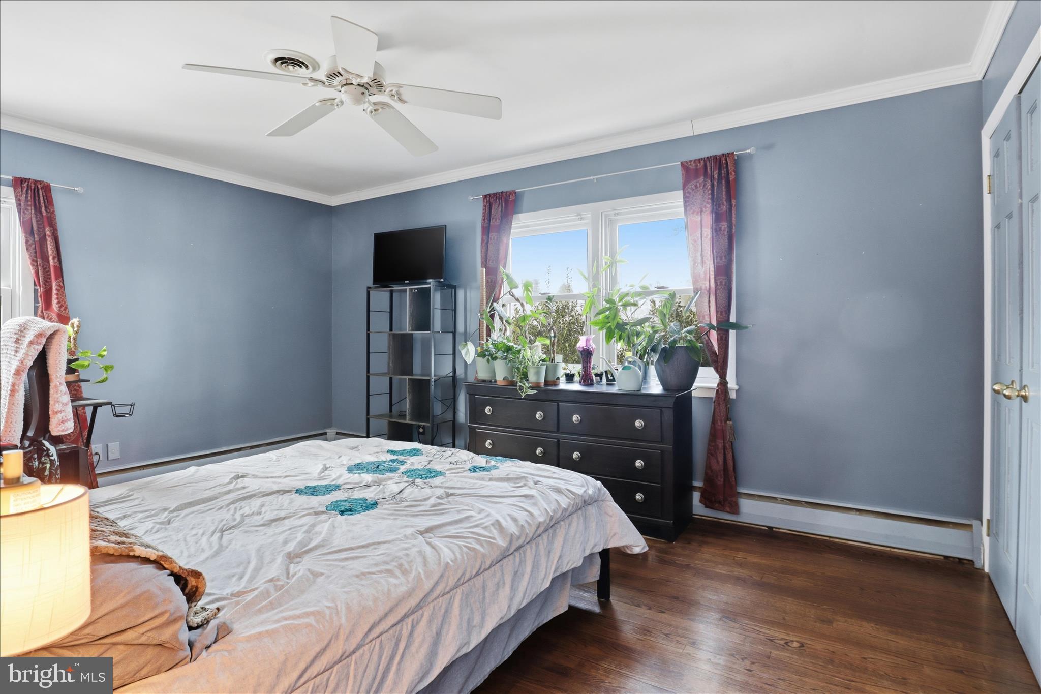 6415 South Clifton Road Frederick, MD 21703 - Photo 23 of 53 a bedroom with a bed potted plant on the dresser and a potted plant