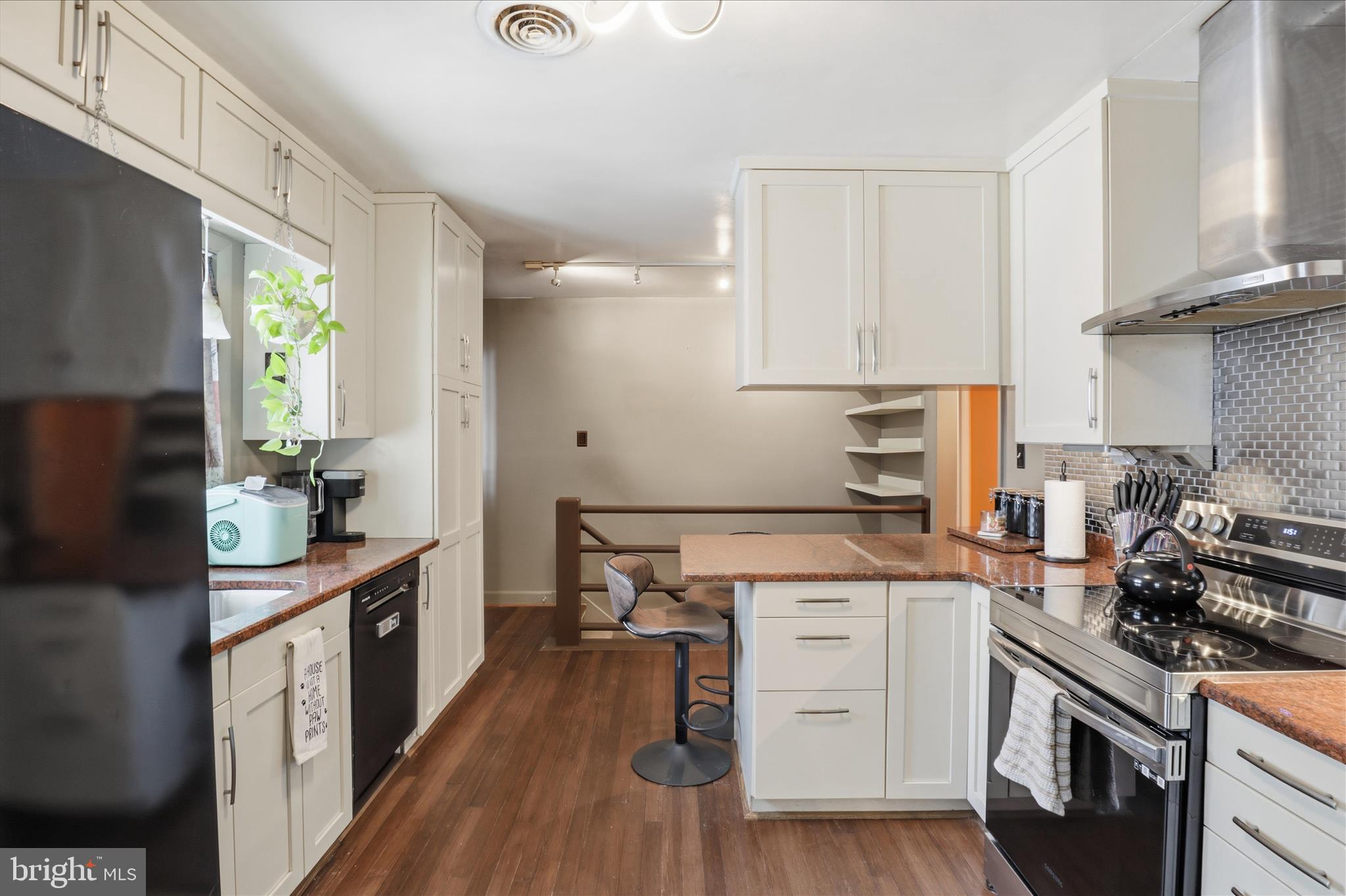 6415 South Clifton Road Frederick, MD 21703 - Photo 26 of 53 a kitchen with a stove a sink and a refrigerator