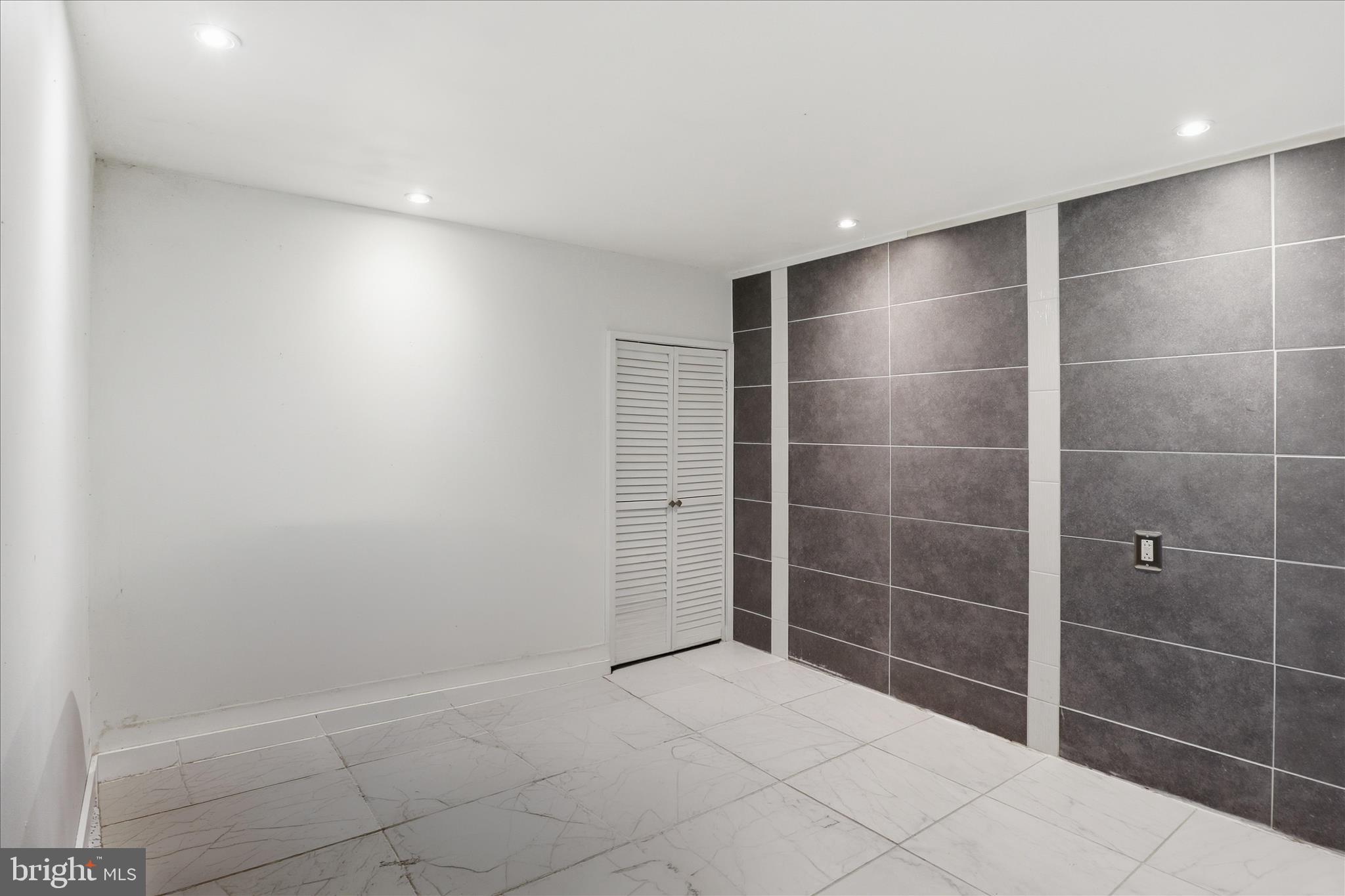 6415 South Clifton Road Frederick, MD 21703 - Photo 28 of 53 a bathroom with a shower and a glass door