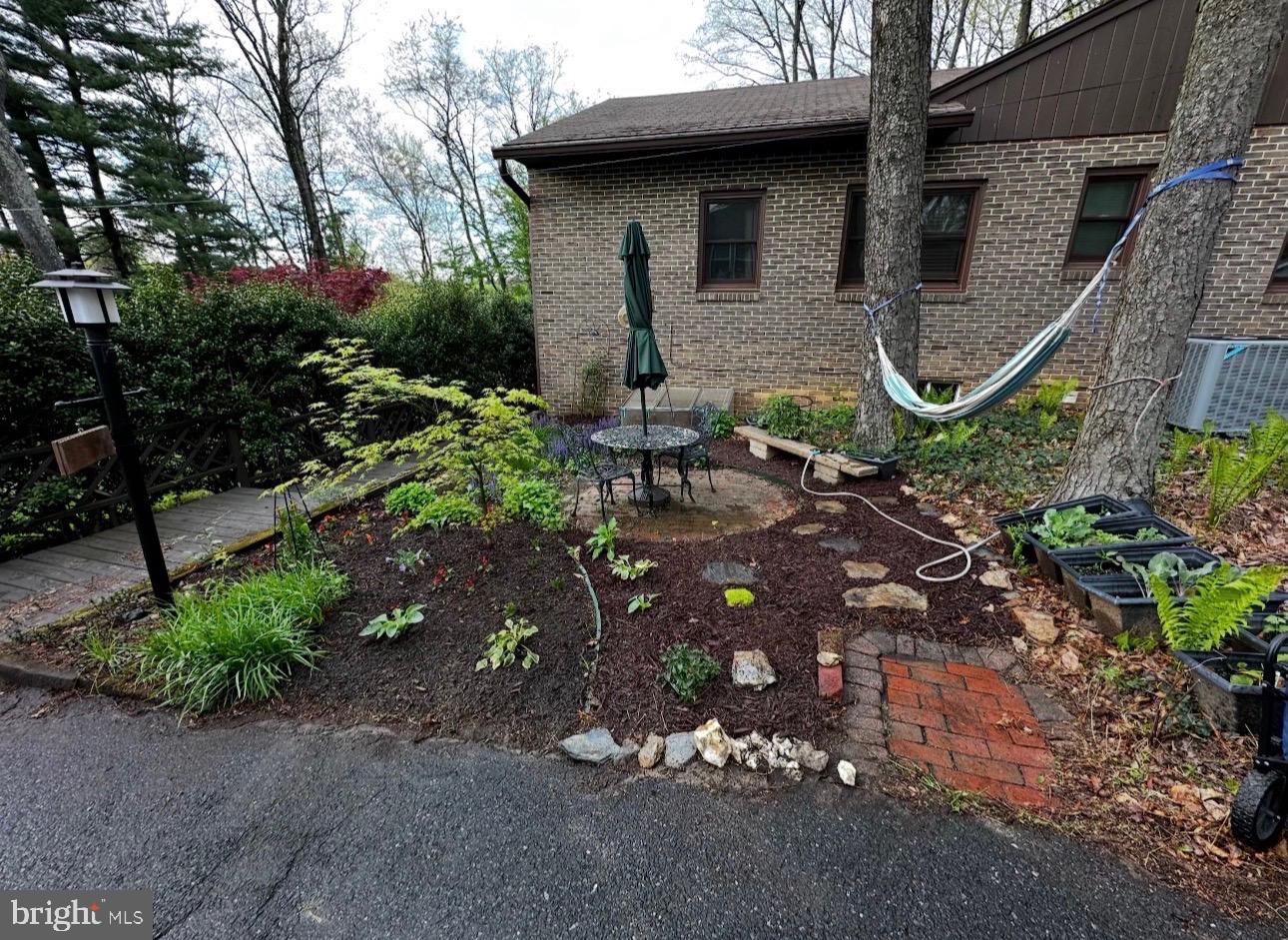 6415 South Clifton Road Frederick, MD 21703 - Photo 9 of 53 a front view of a house with garden
