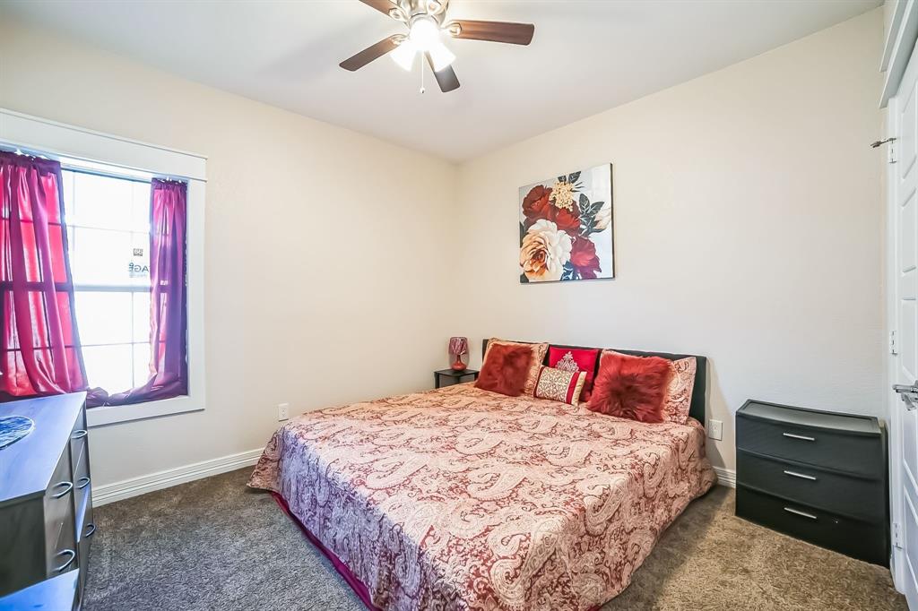 1207 South Lenox Street Tyler, TX 75701 - Photo 20 of 27 a bedroom with a bed and a window