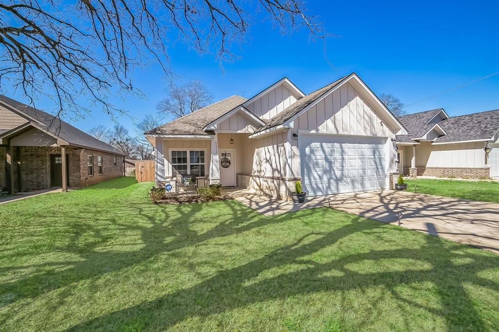 1207 South Lenox Street Tyler, TX 75701 - Photo 2 of 27 a view of a house with a big yard and potted plants