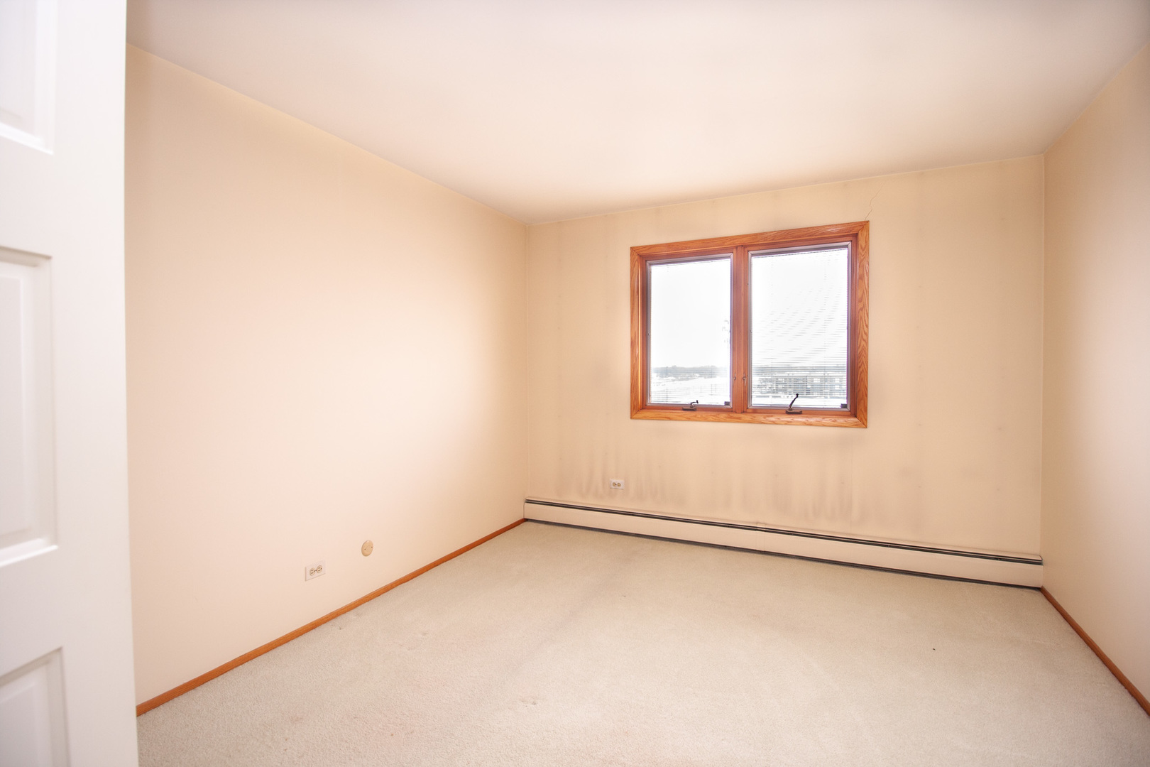8045 O Connor Drive, Unit 6A River Grove, IL 60171 - Photo 4 of 8 an empty room with a window